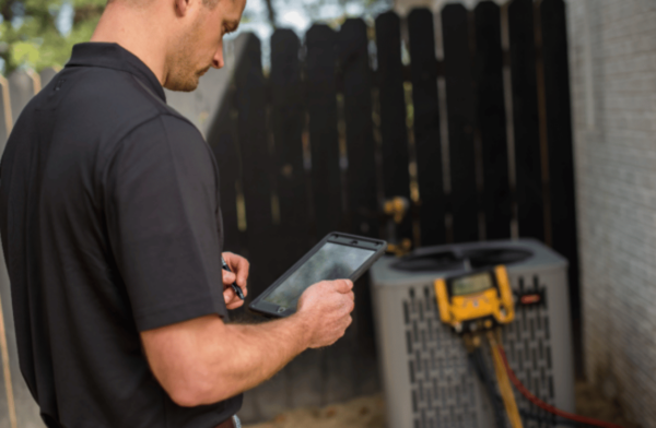 technician performing hvac maintenance in eureka springs