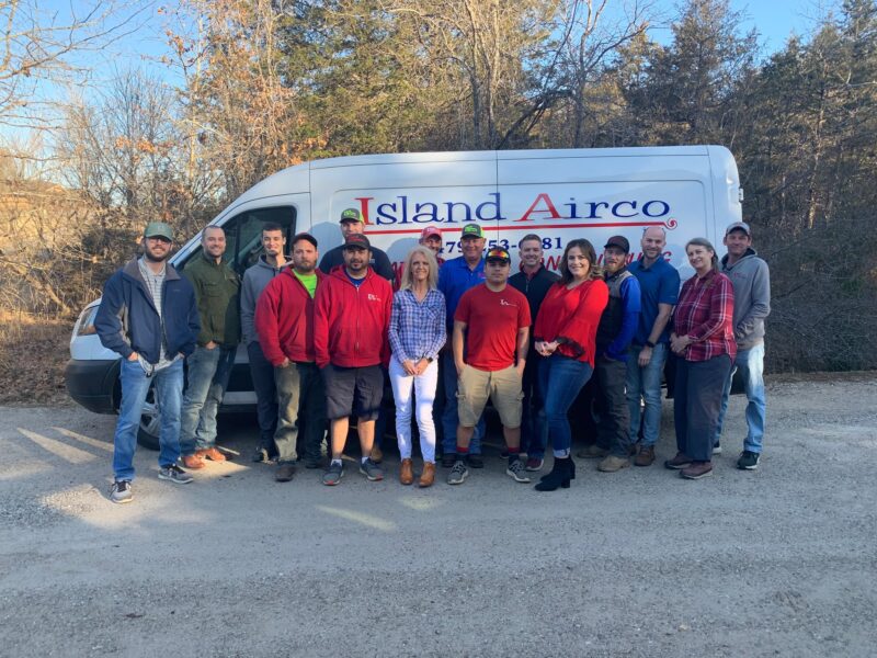 island airco team standing in front of company van